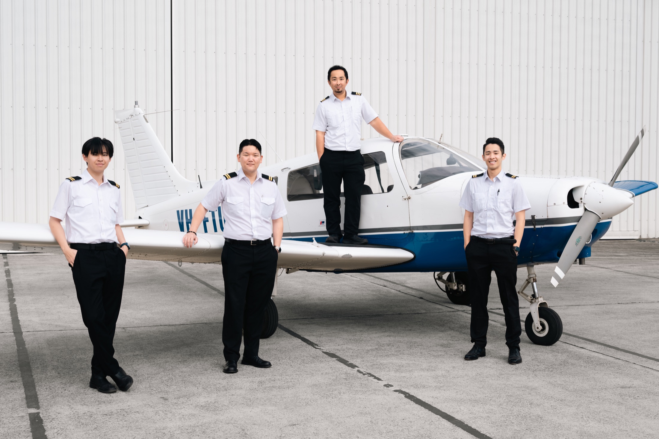 HoneyBee Air instructors and team with a training aircraft at Bankstown